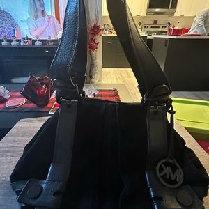 Michael Kors black suede/ leather purse . Measures 15.5in wide x 9in tall
